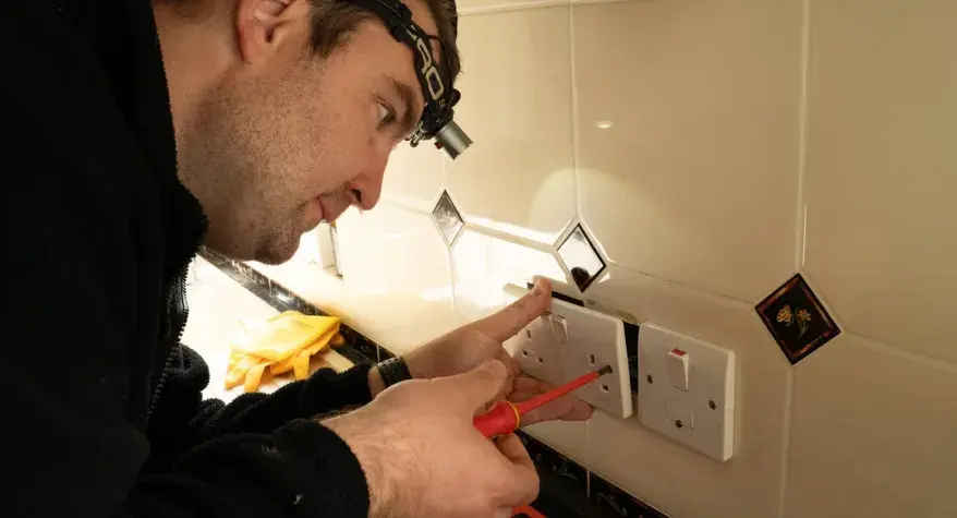 Adam installing a socket